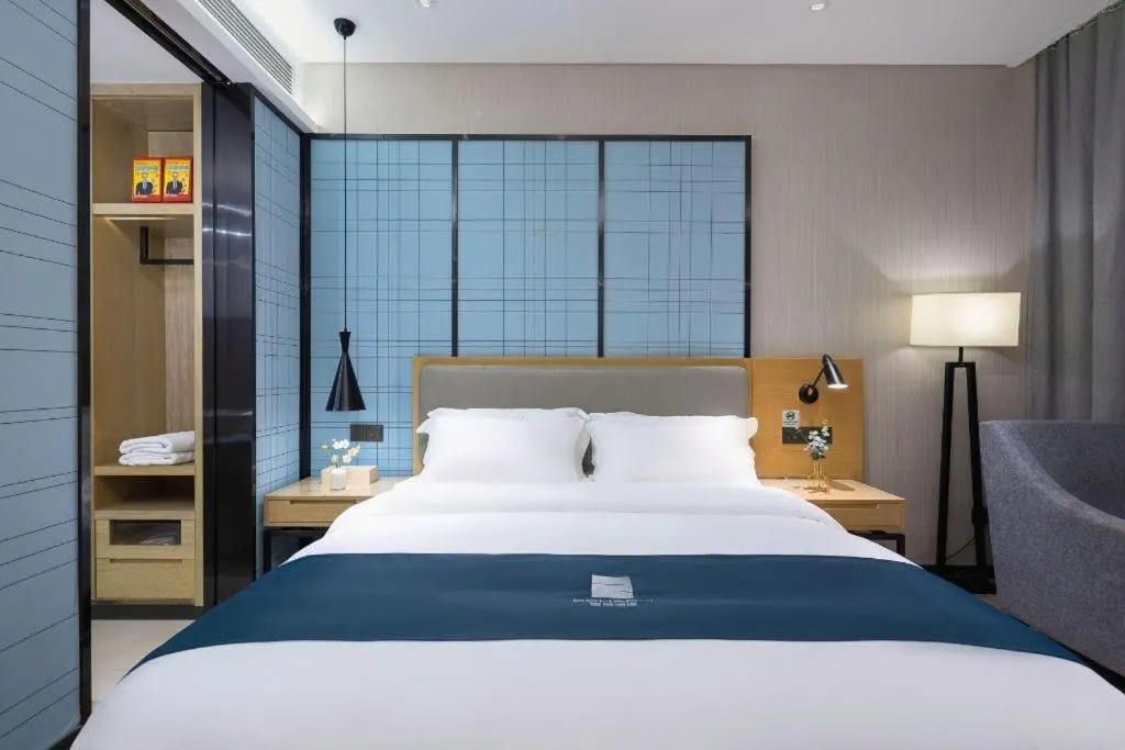 Bed in Echarm Hotel Danzhou Xiari Plaza