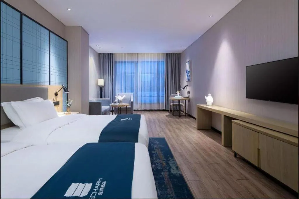 Bed in Echarm Hotel Danzhou Xiari Plaza