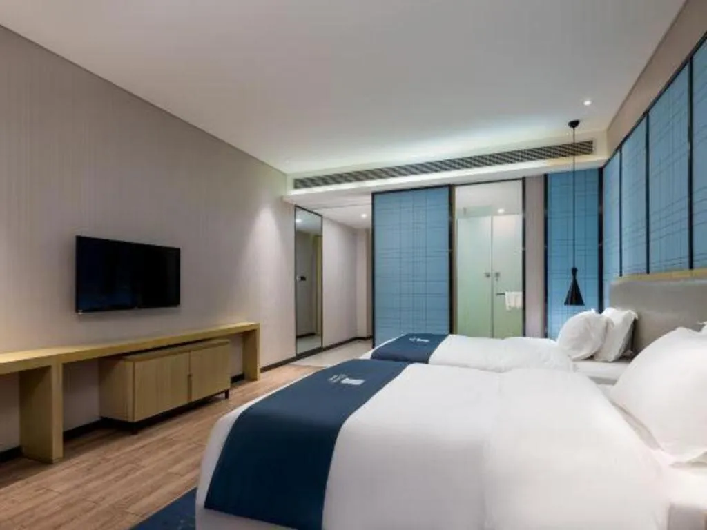 Bed in Echarm Hotel Danzhou Xiari Plaza