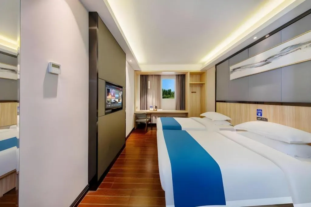 Bed in Wenxing Hotel Guangzhou Gangding Metro Station Branch