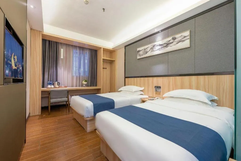 Bed in Wenxing Hotel Guangzhou Gangding Metro Station Branch