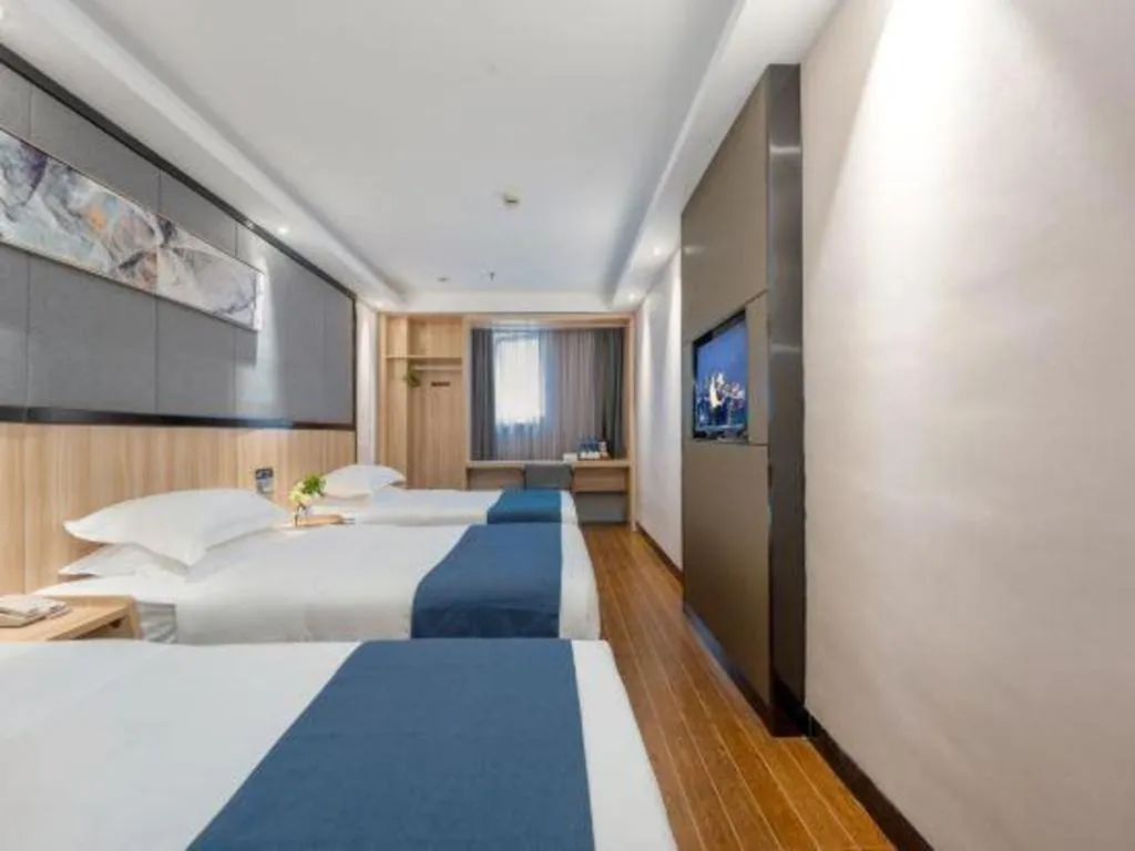 Bed in Wenxing Hotel Guangzhou Gangding Metro Station Branch