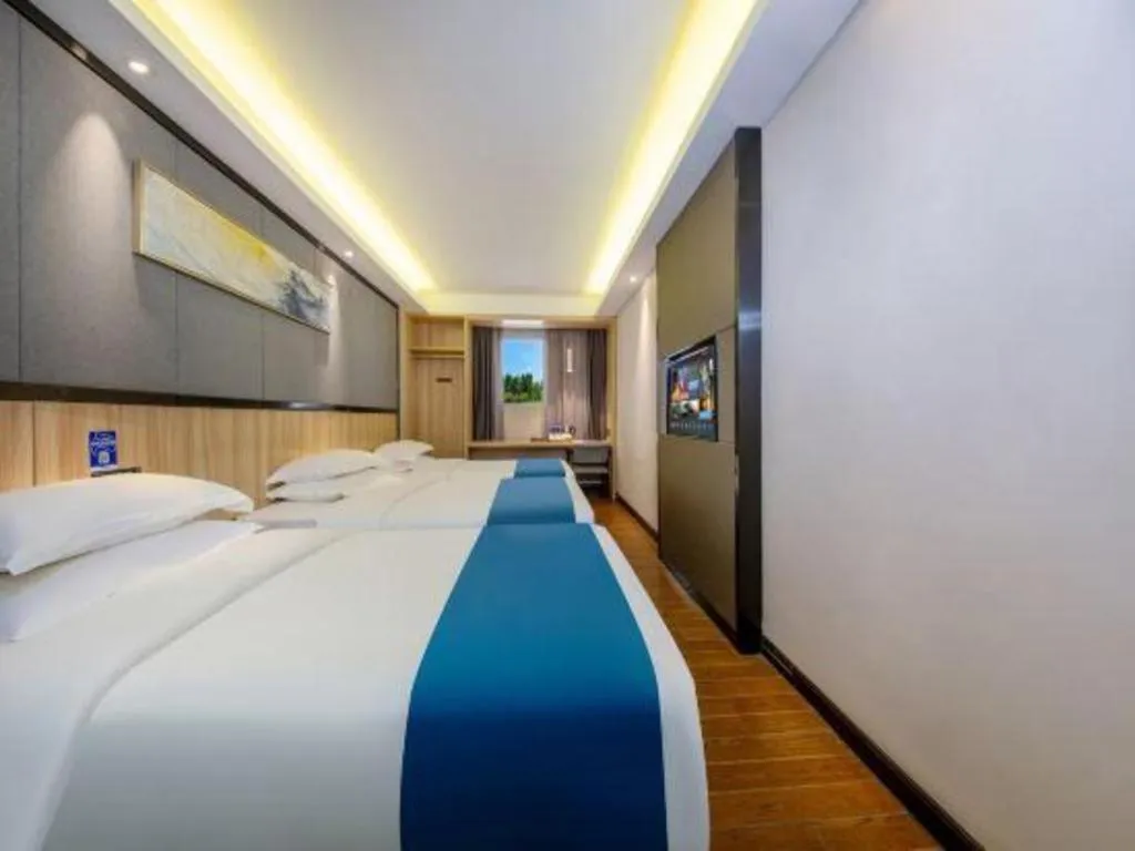 Bed in Wenxing Hotel Guangzhou Gangding Metro Station Branch