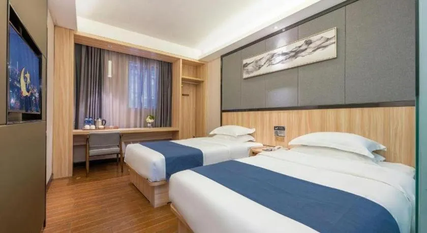 Bed in Wenxing Hotel Guangzhou Gangding Metro Station Branch