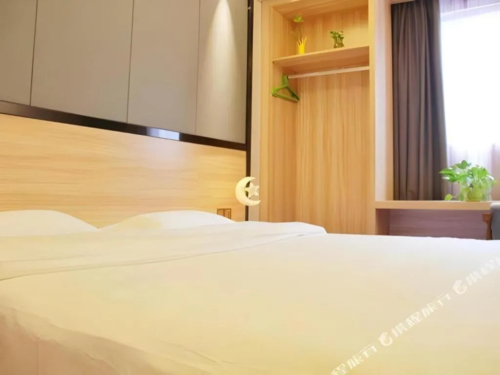 Bed in Wenxing Hotel Guangzhou Gangding Metro Station Branch