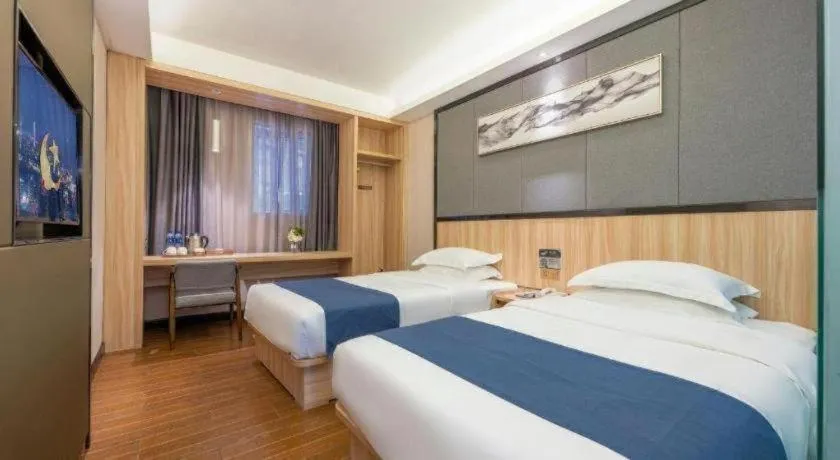 Bed in Wenxing Hotel Guangzhou Gangding Metro Station Branch