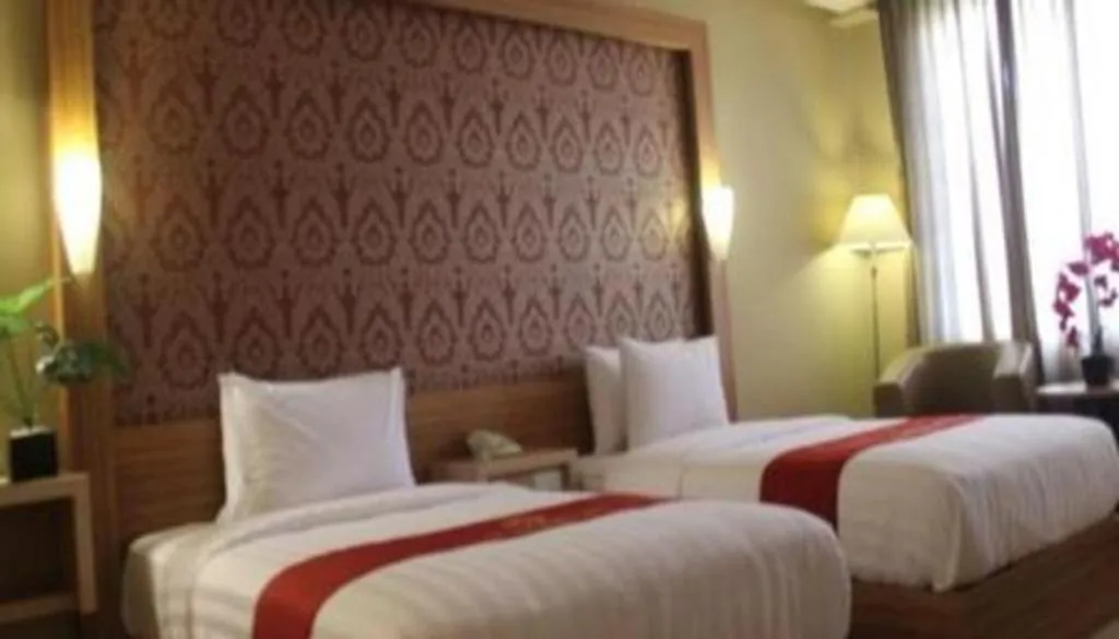 Bed in Grand Dian Hotel Slawi