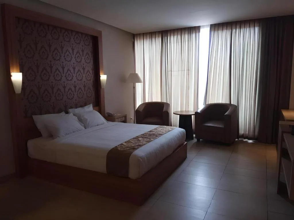 Bed in Grand Dian Hotel Slawi