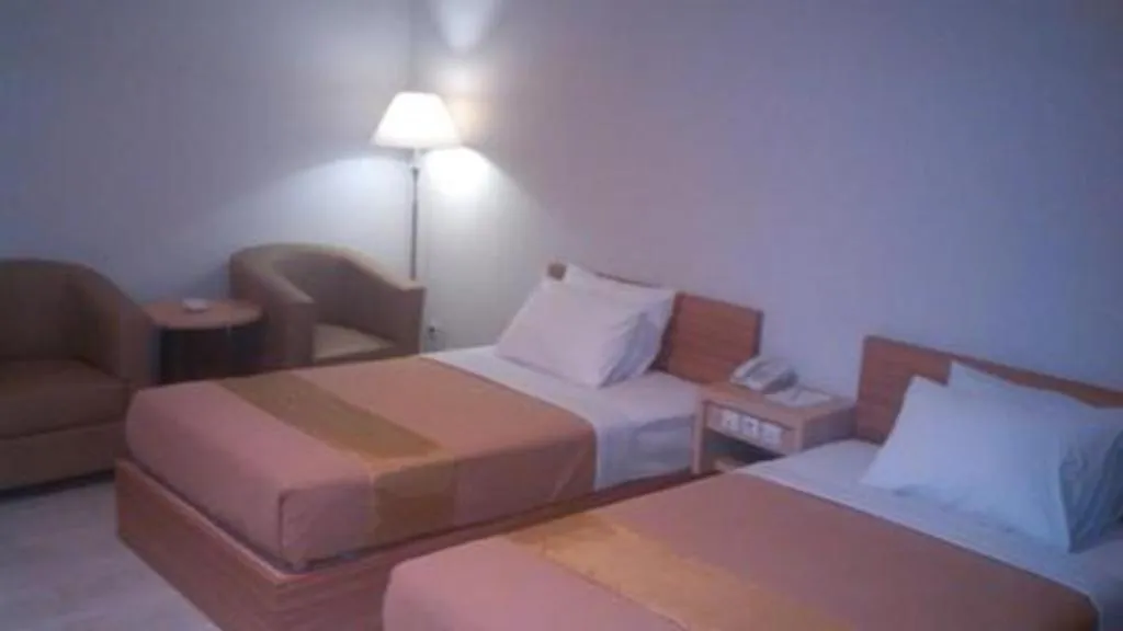 Bed in Grand Dian Hotel Slawi