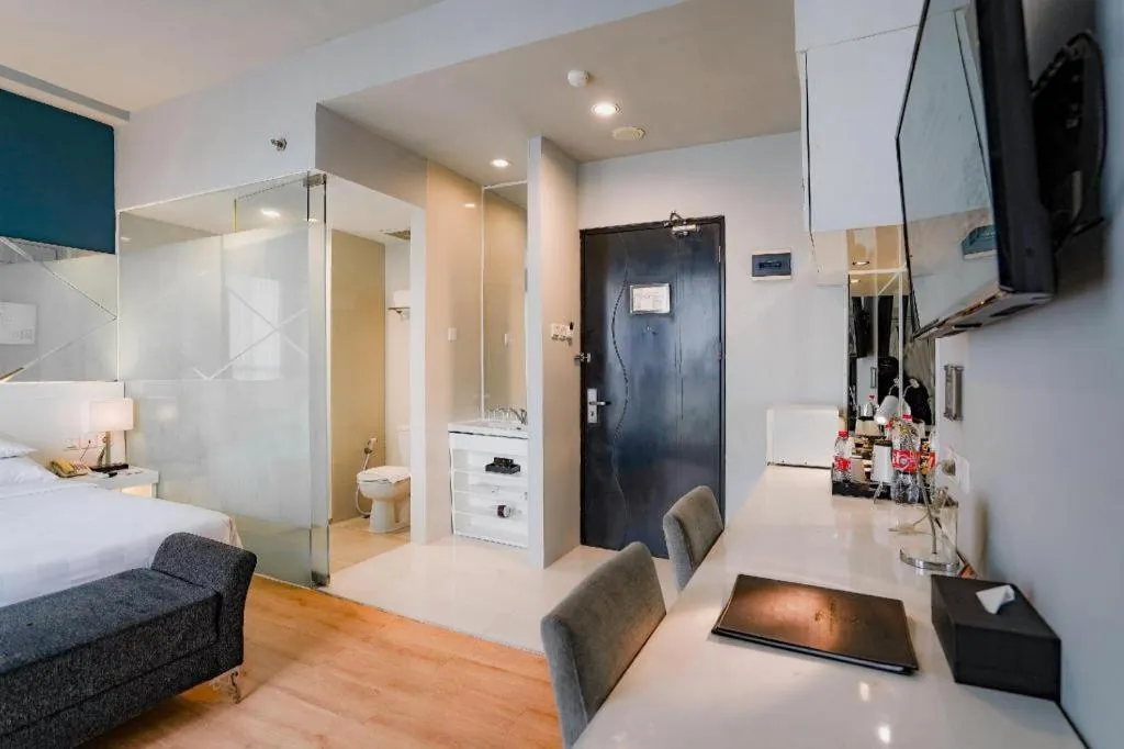 Bed in Grand Darmo Suite by AMITHYA