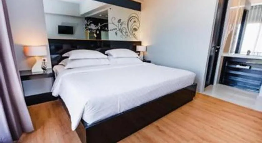 Bed in Grand Darmo Suite by AMITHYA