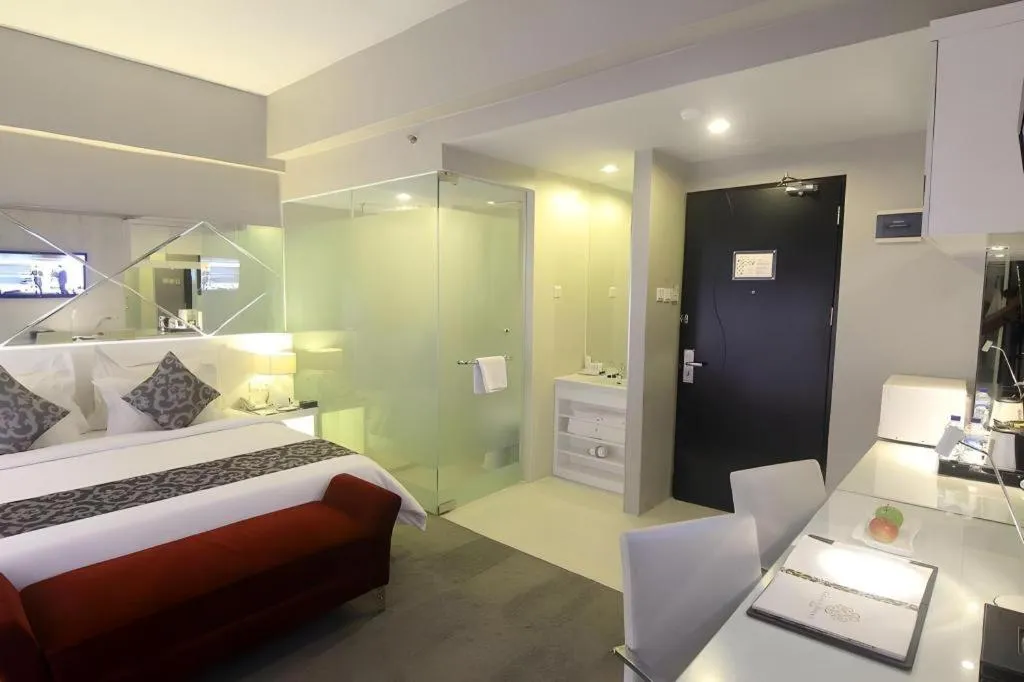 Bed in Grand Darmo Suite by AMITHYA