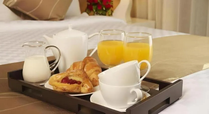 Bed in Grand Darmo Suite by AMITHYA