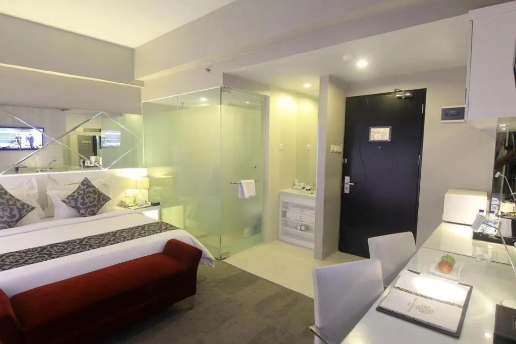 Bed in Grand Darmo Suite by AMITHYA