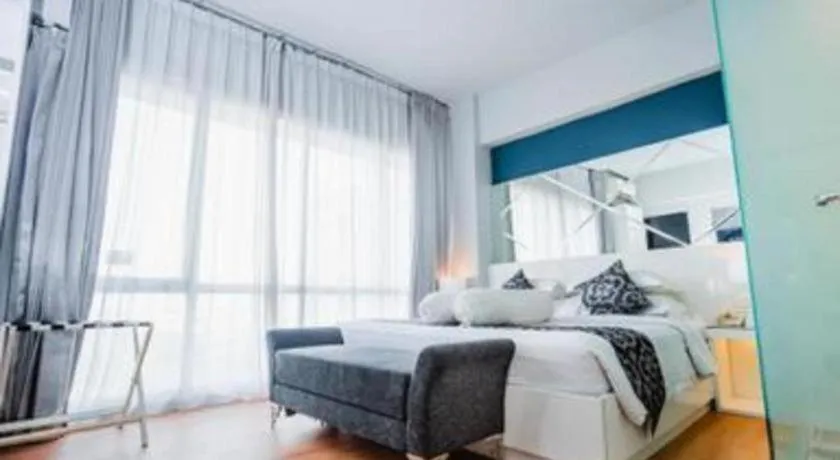 Bed in Grand Darmo Suite by AMITHYA