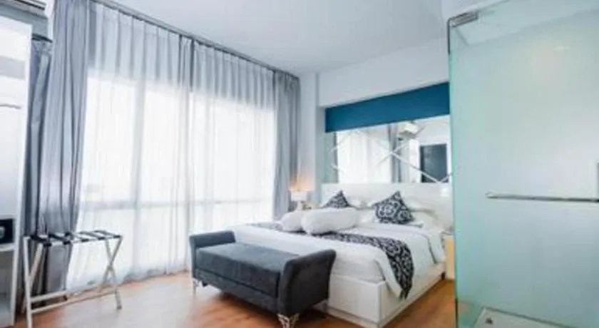 Bed in Grand Darmo Suite by AMITHYA