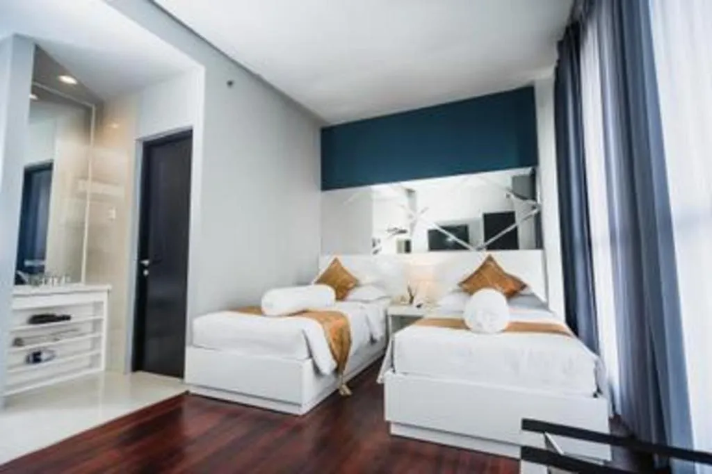 Bed in Grand Darmo Suite by AMITHYA