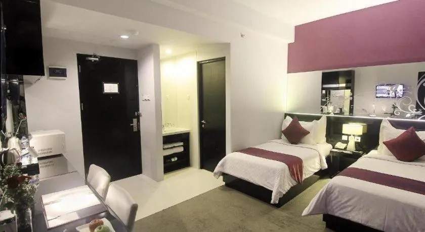 Bed in Grand Darmo Suite by AMITHYA