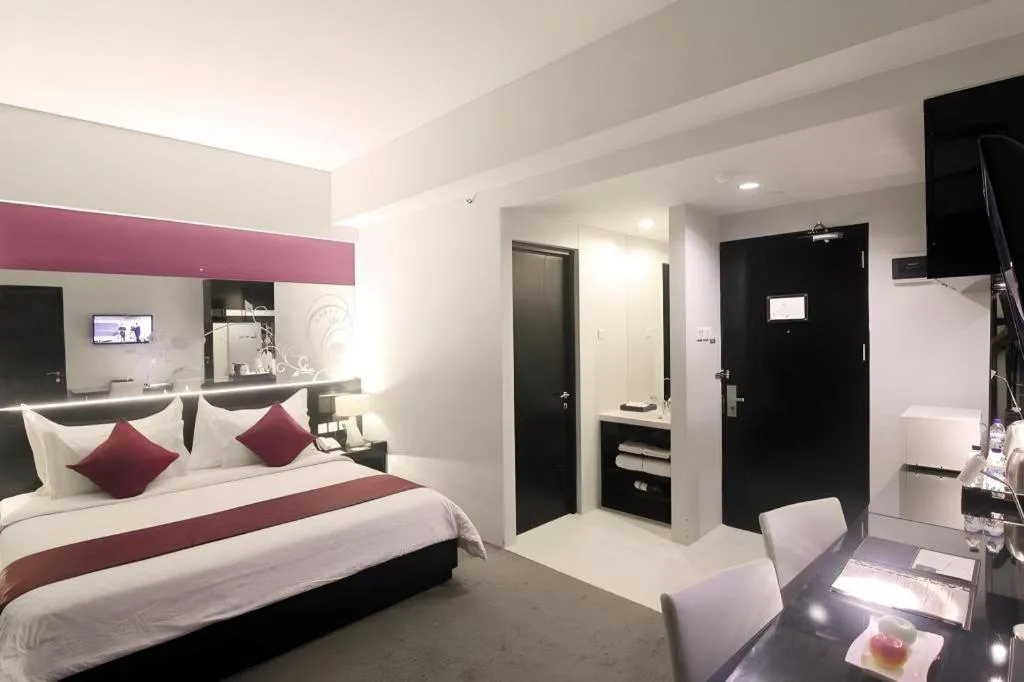 Bed in Grand Darmo Suite by AMITHYA