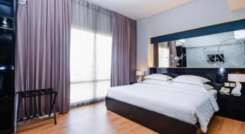 Bed in Grand Darmo Suite by AMITHYA