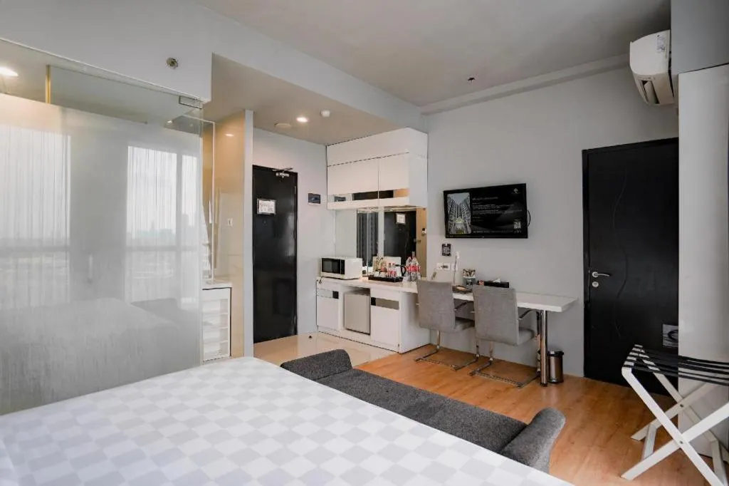 Bed in Grand Darmo Suite by AMITHYA