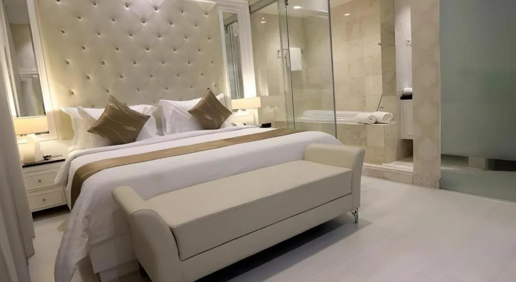 Bed in Grand Darmo Suite by AMITHYA