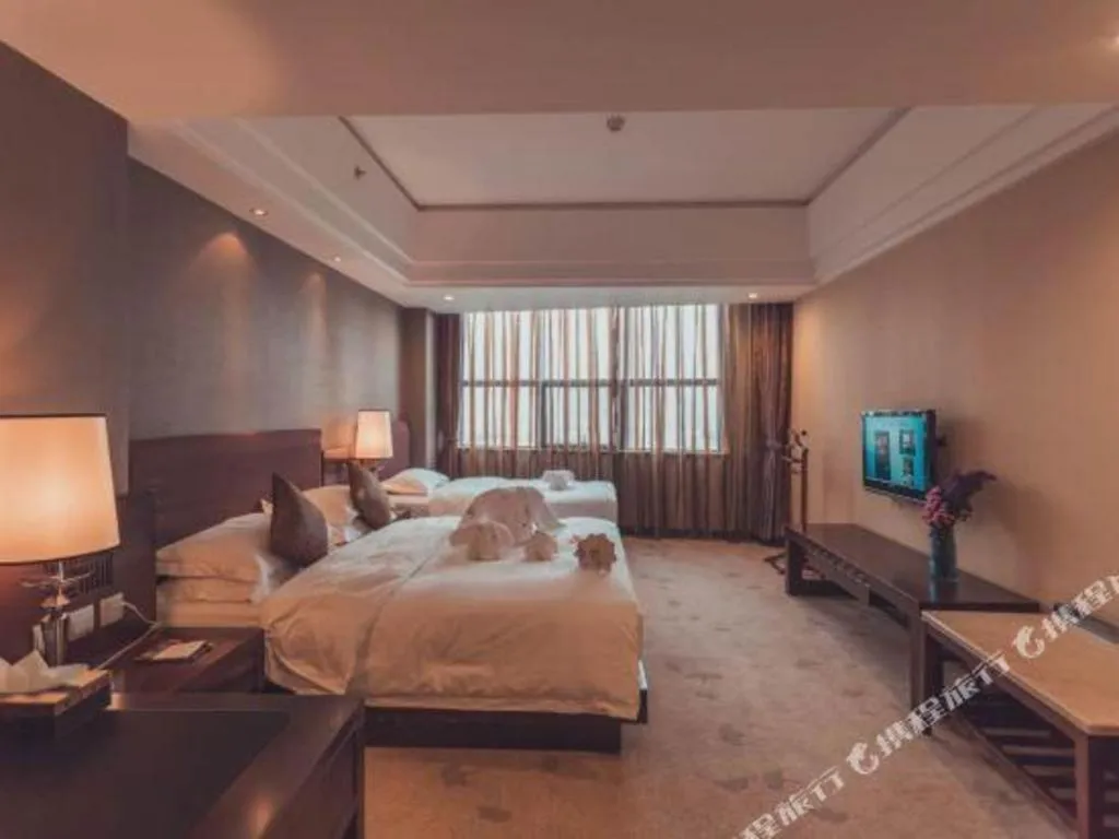 Bed in Kunming Wenhui Hotel