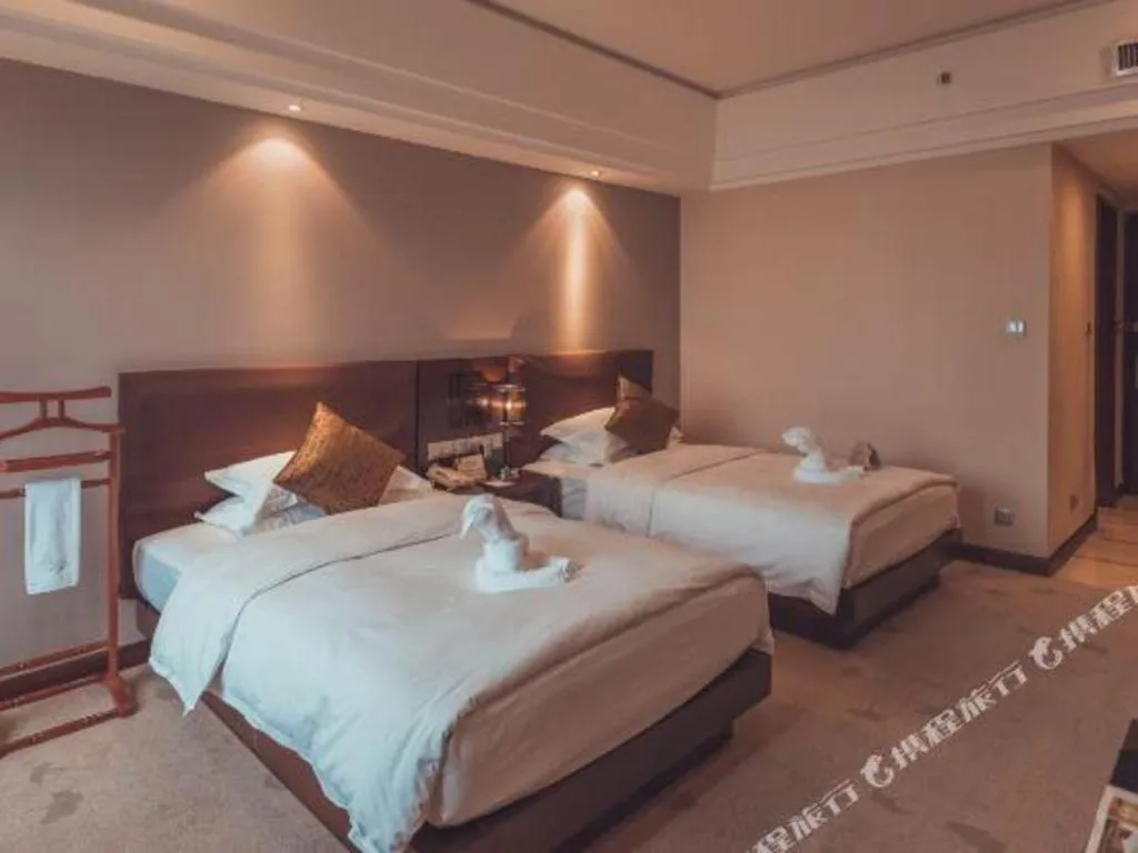 Bed in Kunming Wenhui Hotel