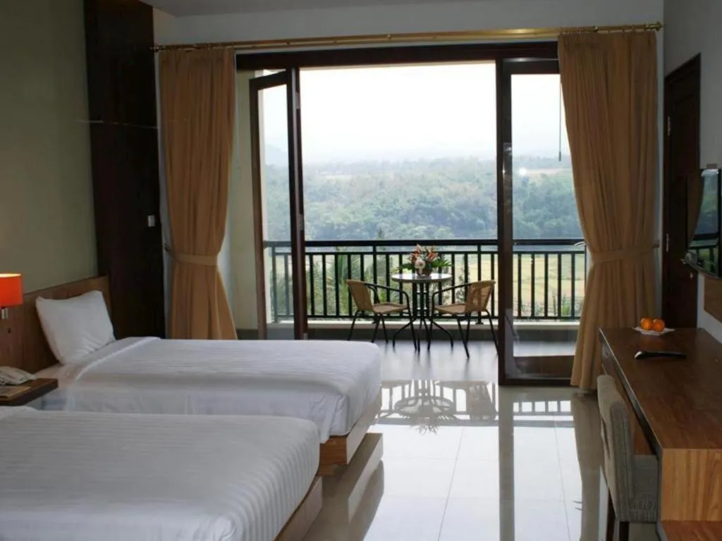 Bed in The Oxalis Regency Hotel