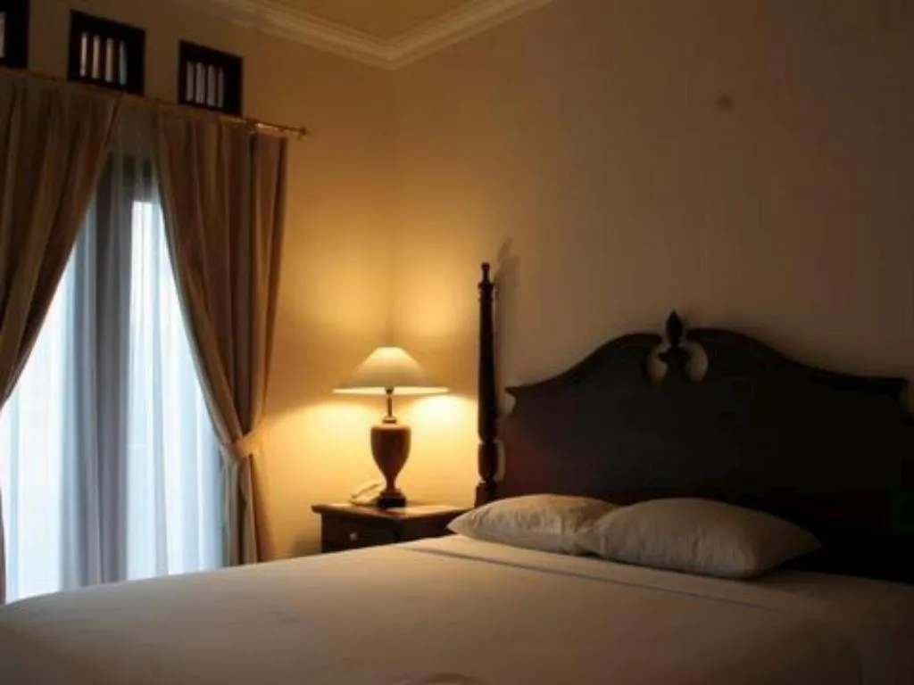 Bed in The Oxalis Regency Hotel