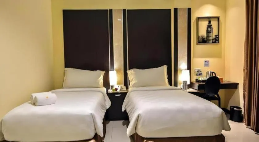 Bed in Sunbreeze Hotel