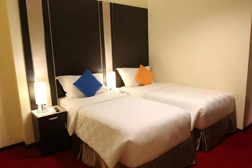 Bed in Sunbreeze Hotel