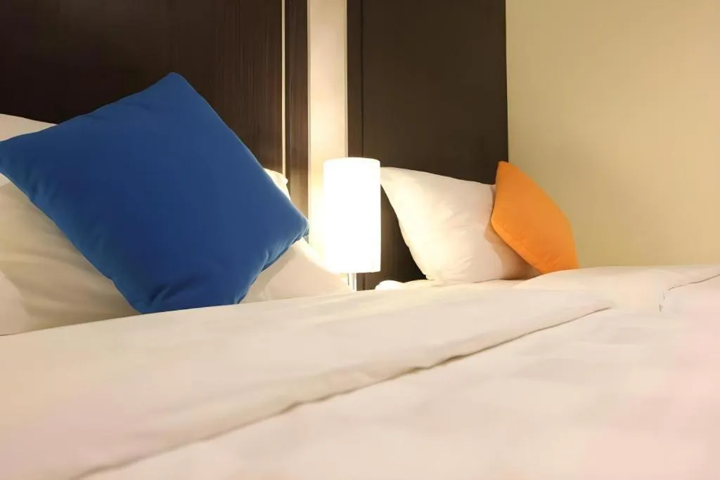 Bed in Sunbreeze Hotel