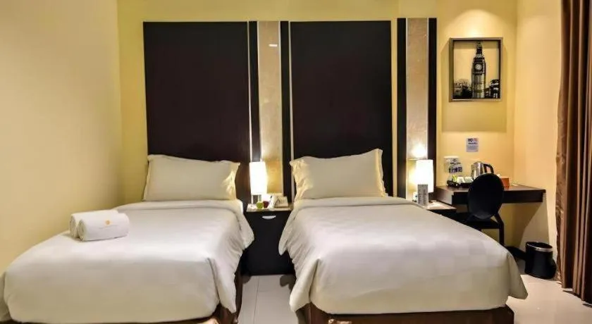 Bed in Sunbreeze Hotel