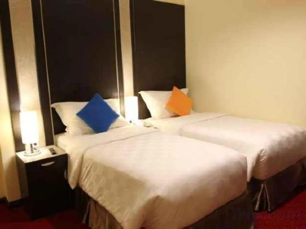 Bed in Sunbreeze Hotel