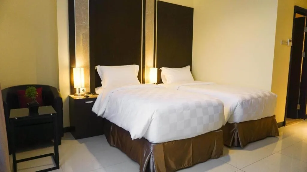 Bed in Sunbreeze Hotel