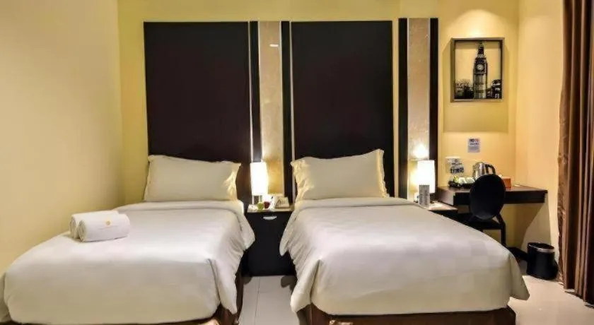 Bed in Sunbreeze Hotel