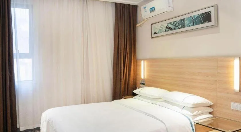 Bed in City Comfort Inn Yichang Gezhouba CBD Shopping Center