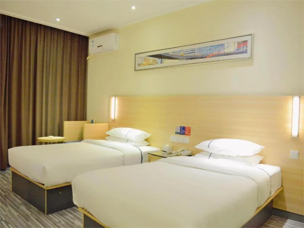 Bed in City Comfort Inn Yichang Gezhouba CBD Shopping Center
