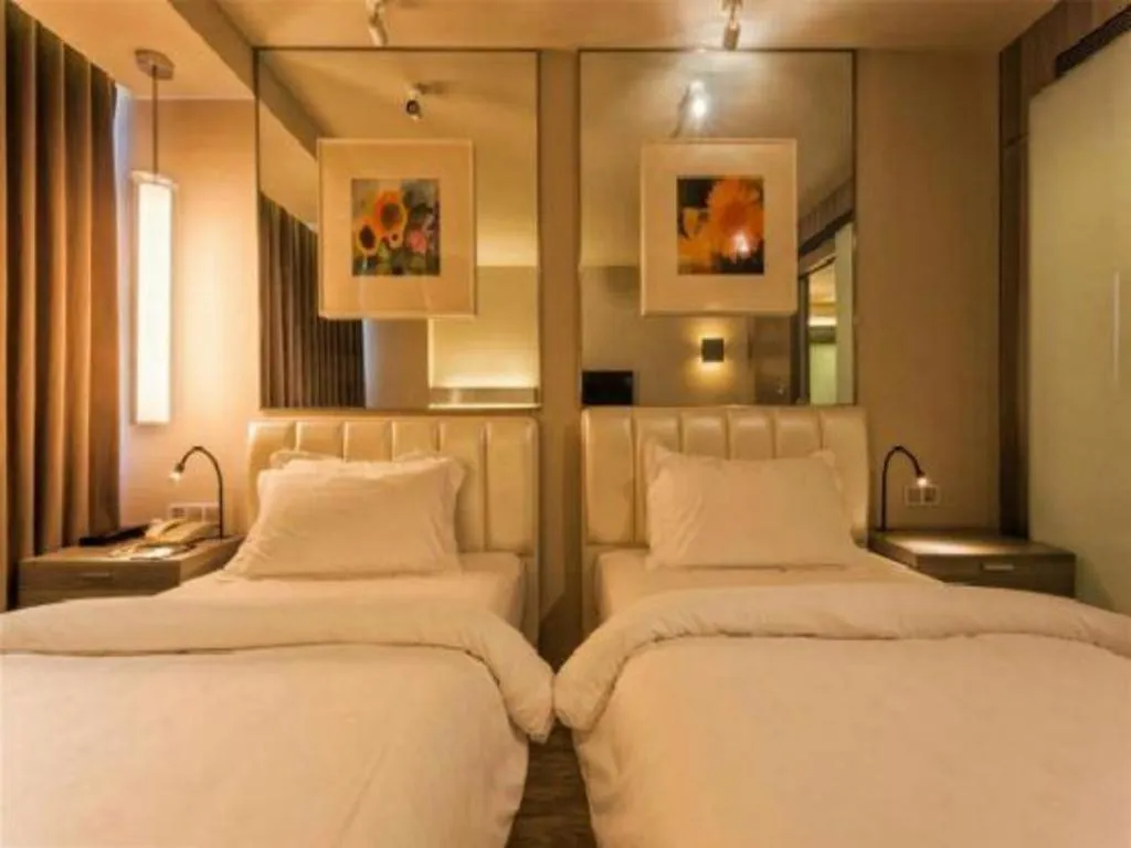 Bed in Jinjiang Metropolo Hotel - Qingdao Chengyang District Government