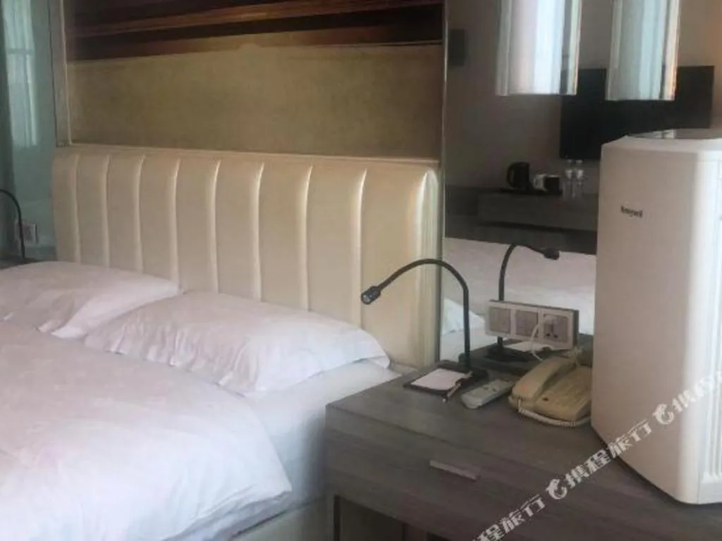 Bed in Jinjiang Metropolo Hotel - Qingdao Chengyang District Government