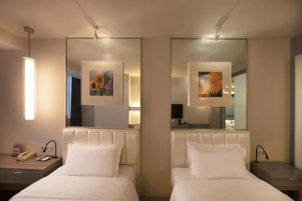 Bed in Jinjiang Metropolo Hotel - Qingdao Chengyang District Government