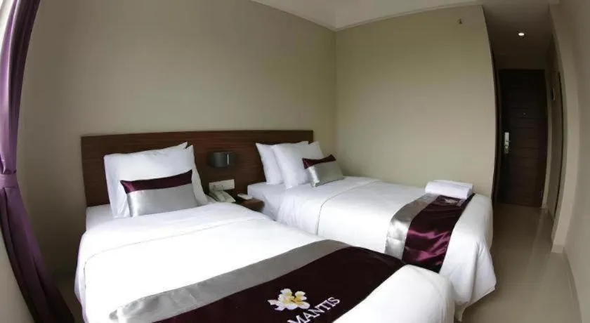 Bed in Amantis Hotel