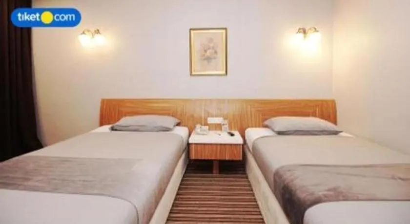 Bed in Kenari Tower Hotel