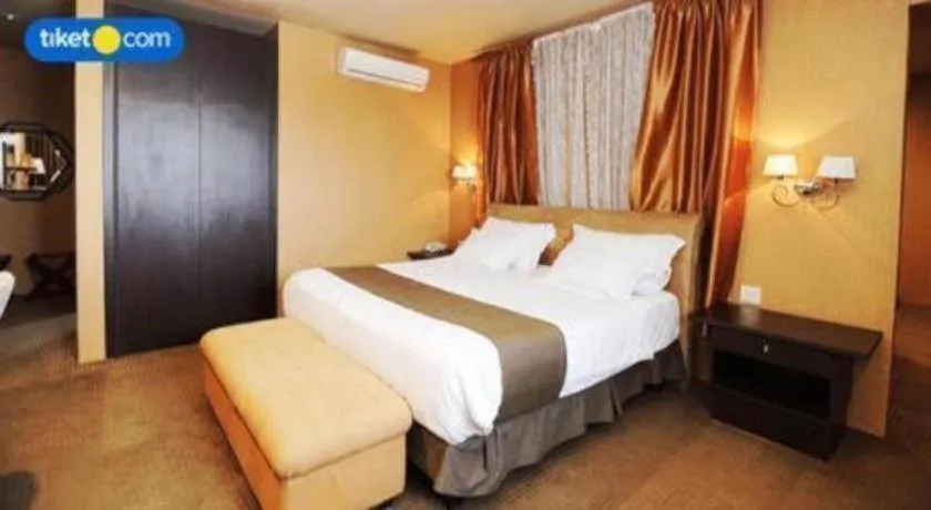 Bed in Kenari Tower Hotel