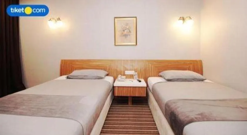 Bed in Kenari Tower Hotel