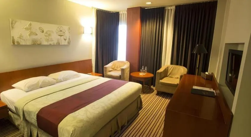 Bed in Kenari Tower Hotel