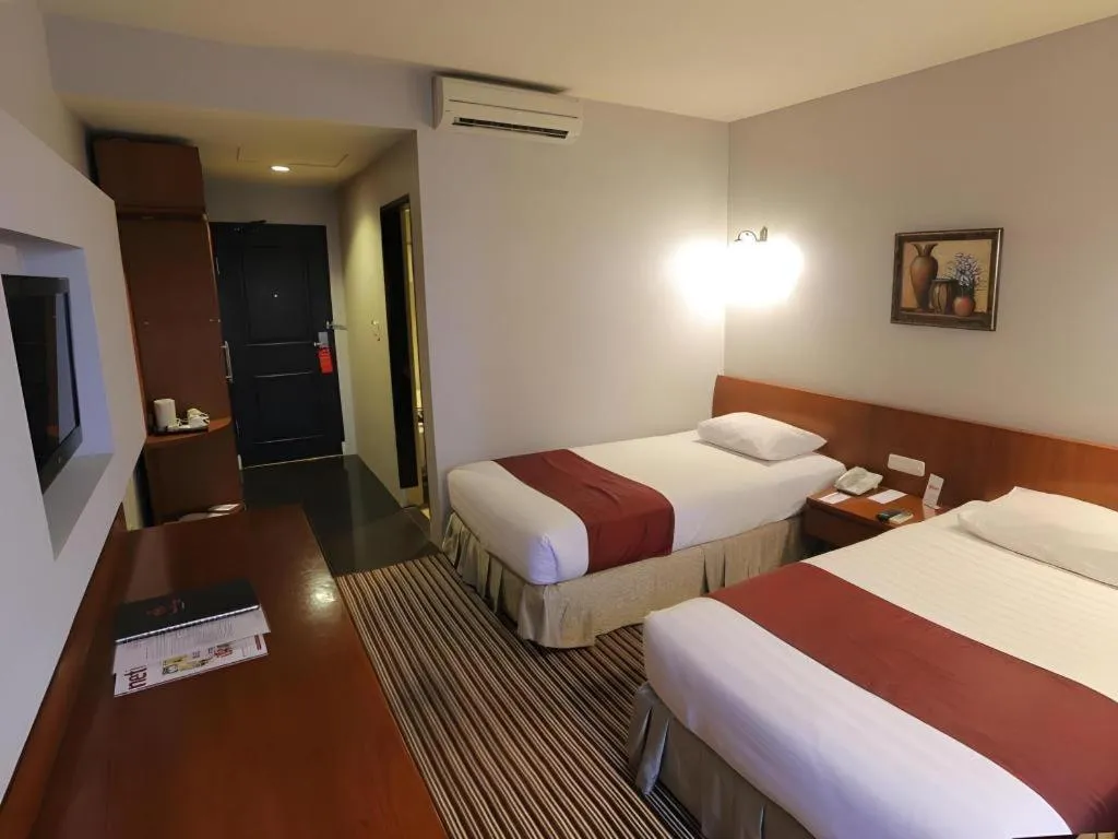 Bed in Kenari Tower Hotel