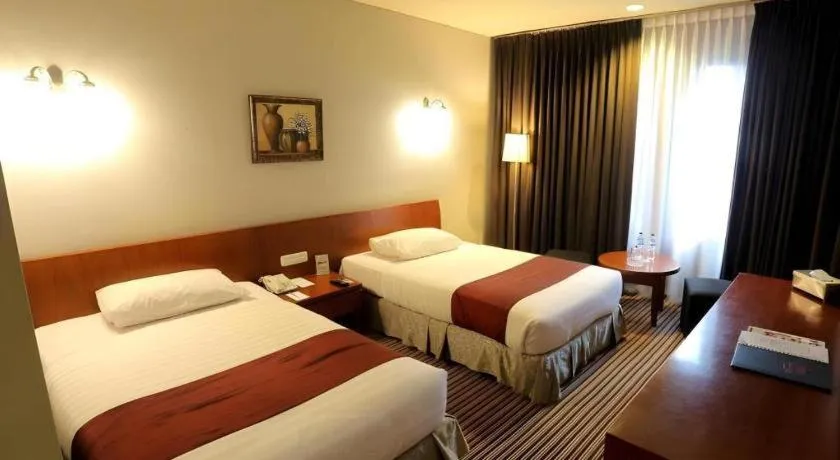 Bed in Kenari Tower Hotel