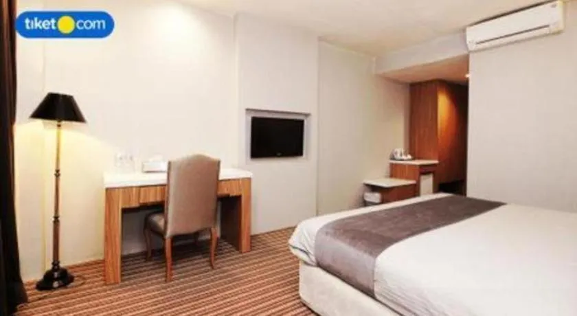 Bed in Kenari Tower Hotel